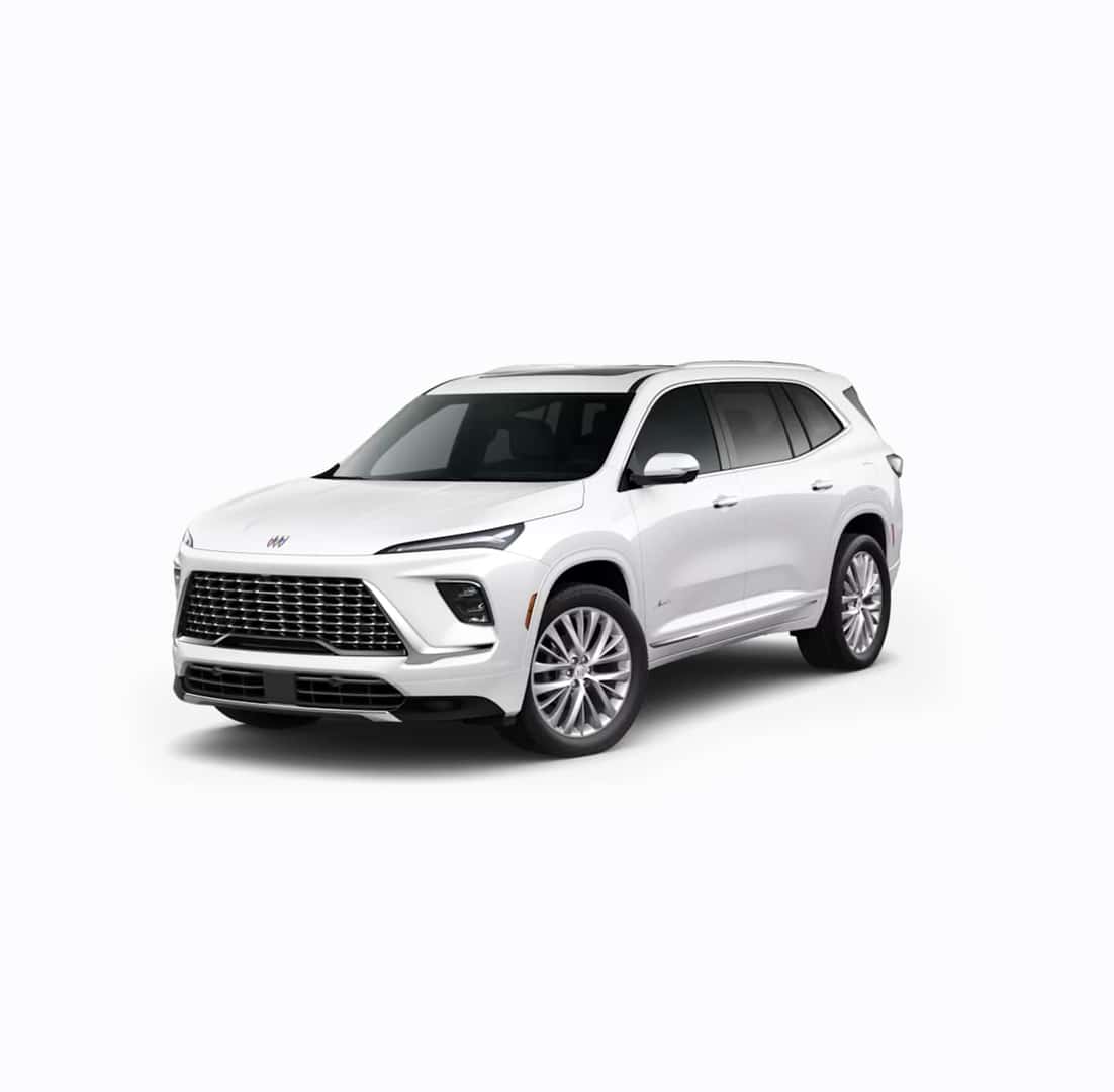 A white SUV with sleek, modern design features prominent front grille, angular headlights, and large wheels. The vehicle is positioned at an angle, showcasing its side profile and front. The background is plain white.