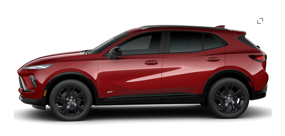 Rear view of a black Buick Envision Avenir SUV with sleek design and dual exhausts.